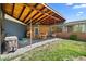 Covered patio area with dining set, ideal for outdoor entertaining and relaxing in the backyard at 2717 S Steele St, Denver, CO 80210