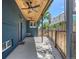 Spacious covered back patio featuring a beautifully crafted wooden ceiling, providing an outdoor extension for relaxation and social gatherings at 2577 Depew St, Edgewater, CO 80214