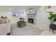 Finished basement with stone fireplace, large screen TV, neutral decor and recessed lighting at 2577 Depew St, Edgewater, CO 80214