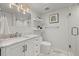 Modern bathroom with marble countertop, glass-enclosed shower, bright vanity lighting, and a comfortable, stylish ambiance at 2577 Depew St, Edgewater, CO 80214