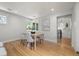 Cozy dining area with natural light, hardwood floors, and modern decor for intimate meals at 2577 Depew St, Edgewater, CO 80214