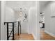 Bright hallway with hardwood floors, decorative lighting, leading to bedroom, and elegant finishes at 2577 Depew St, Edgewater, CO 80214