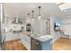 Stylish kitchen with a large island, modern appliances, and open layout, ideal for cooking and entertaining at 2577 Depew St, Edgewater, CO 80214
