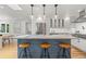 Beautiful kitchen with a large island with marble countertop and modern stainless steel appliances at 2577 Depew St, Edgewater, CO 80214