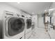 Functional laundry room with updated washer and dryer, offering convenience and efficiency for household chores at 2577 Depew St, Edgewater, CO 80214