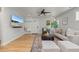 Inviting living room with hardwood floors, stylish decor, and a relaxing atmosphere at 2577 Depew St, Edgewater, CO 80214