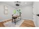 Cozy home office with a bright corner window, hardwood floors, and neutral decor at 2577 Depew St, Edgewater, CO 80214