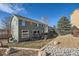 A beautiful backyard with a wooden deck and rockscaping, perfect for outdoor entertaining and relaxation at 3938 Lazy K Dr, Castle Rock, CO 80104