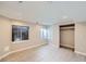 Finished basement with wood-look tile flooring, recessed lights, and an egress window at 3938 Lazy K Dr, Castle Rock, CO 80104