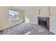 Bedroom with a large window and cozy fireplace, creating a relaxing atmosphere at 3938 Lazy K Dr, Castle Rock, CO 80104