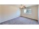 Bedroom with plush carpeting, neutral colors, and a window at 3938 Lazy K Dr, Castle Rock, CO 80104