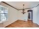 Well-lit dining room featuring hardwood floors, decorative chandelier, and large windows at 3938 Lazy K Dr, Castle Rock, CO 80104