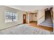 Inviting entryway with wood door, staircase, and access to a dining room with a chandelier at 3938 Lazy K Dr, Castle Rock, CO 80104