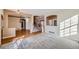 Inviting living room with plush carpeting, and elegant arches and doorways at 3938 Lazy K Dr, Castle Rock, CO 80104