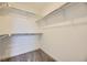 Walk-in closet with built-in shelving and carpeted flooring at 7307 Waterleaf Trl, Littleton, CO 80125