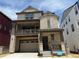 Charming two-story home featuring a stone facade, balcony, and attached two-car garage at 7307 Waterleaf Trl, Littleton, CO 80125