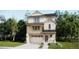 Charming two-story home featuring stone accents, a balcony, and a well-maintained lawn and attached two car garage at 7307 Waterleaf Trl, Littleton, CO 80125