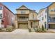 Two-story home with stone and wood accents, a front porch, and an attached two-car garage at 7307 Waterleaf Trl, Littleton, CO 80125