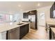 Kitchen view featuring stainless steel appliances, and a bright, open design at 7307 Waterleaf Trl, Littleton, CO 80125