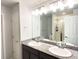 Bathroom features a double vanity with granite countertops and a glass-enclosed shower at 19221 E 65Th Ave, Denver, CO 80249