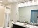 Bathroom featuring double sinks, granite countertops, and a shower-tub combination at 19221 E 65Th Ave, Denver, CO 80249