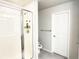 Modern bathroom with a glass shower, toilet, and sleek fixtures, offering a clean and functional design at 19221 E 65Th Ave, Denver, CO 80249