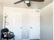 Carpeted bedroom with two closets, and a ceiling fan at 19221 E 65Th Ave, Denver, CO 80249