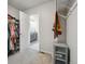 Organized walk-in closet with shelves and access to the bathroom at 19221 E 65Th Ave, Denver, CO 80249