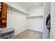 Walk-in closet featuring adjustable shelving, carpeted floor and plenty of storage space at 19221 E 65Th Ave, Denver, CO 80249