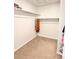 Walk-in closet offering ample storage space with shelving and rods for organized clothing and accessories at 19221 E 65Th Ave, Denver, CO 80249