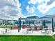 Community grill area featuring built in grills, tables, and landscaped space at 19221 E 65Th Ave, Denver, CO 80249