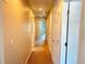 Hallway with neutral walls and carpet flooring, connecting to various rooms at 19221 E 65Th Ave, Denver, CO 80249