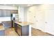 Well-designed kitchen with a center island, stainless steel appliances, and plenty of storage at 19221 E 65Th Ave, Denver, CO 80249