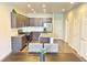 Spacious kitchen featuring a center island, ample cabinet space, and modern stainless steel appliances at 19221 E 65Th Ave, Denver, CO 80249
