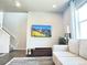 Cozy living room with modern media console, large TV, and comfortable seating area at 19221 E 65Th Ave, Denver, CO 80249