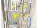 Mechanical room featuring a furnace and tankless water heater at 19221 E 65Th Ave, Denver, CO 80249