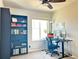 Comfortable carpeted office with a work station, large window and bookshelf at 19221 E 65Th Ave, Denver, CO 80249