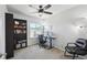 Functional home office with a large window, ceiling fan, and spacious work area at 19221 E 65Th Ave, Denver, CO 80249