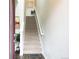 Inviting entry foyer with a staircase leading upstairs, complemented by modern decor and natural light at 19221 E 65Th Ave, Denver, CO 80249