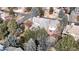 Aerial shot of a brick home with a gray roof, surrounded by mature trees in a peaceful neighborhood at 6414 E Stanford Ave, Cherry Hills Village, CO 80111