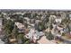 High angle of rooftops of multiple homes with mature trees, representing a serene neighborhood at 6414 E Stanford Ave, Cherry Hills Village, CO 80111