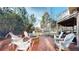 Backyard patio with seating and a fire pit, perfect for outdoor gatherings at 6414 E Stanford Ave, Cherry Hills Village, CO 80111