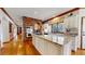 Stylish kitchen with a large island, white cabinets, and stainless steel oven at 6414 E Stanford Ave, Cherry Hills Village, CO 80111