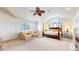 This spacious main bedroom boasts plush carpet, sitting area, and a light, airy feel at 6414 E Stanford Ave, Cherry Hills Village, CO 80111