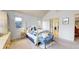 Cozy bedroom features a comfortable bed, closet, and bright doorway at 6414 E Stanford Ave, Cherry Hills Village, CO 80111