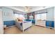 Cheerful bedroom with white furniture, ceiling fan, and fun wall decor at 6414 E Stanford Ave, Cherry Hills Village, CO 80111