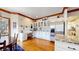 Kitchen boasting stainless steel appliances, white cabinetry, granite countertops, and a cozy breakfast nook at 6414 E Stanford Ave, Cherry Hills Village, CO 80111