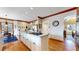 Kitchen with a center island, granite countertops, and hardwood floors at 6414 E Stanford Ave, Cherry Hills Village, CO 80111