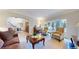 Comfortable living room with large bay window, decorative furniture, vintage piano, and elegant decor at 6414 E Stanford Ave, Cherry Hills Village, CO 80111
