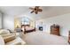 Spacious main bedroom with a fireplace, vaulted ceilings, and a large window that provides lots of light at 6414 E Stanford Ave, Cherry Hills Village, CO 80111